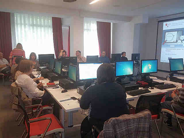 The picture shows the participants of the workshop in practical work and filling in the metadata elements for one source of spatial data on the NSDI Geoportal.